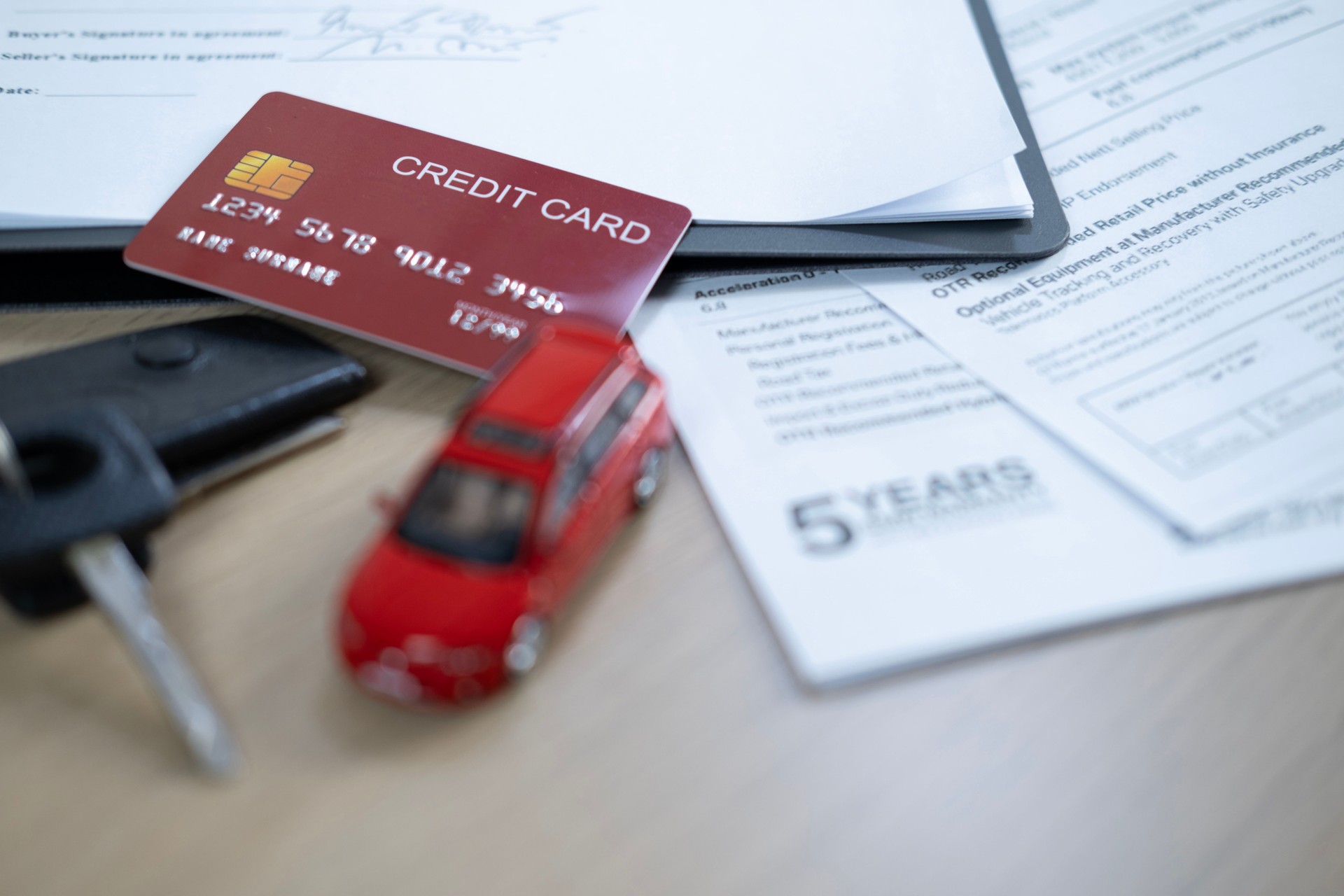 Dealership offered various finance options, including an auto loan or lease, making it easier to buy or rent a car from the company. Agent reviewed contract, finalizing insurance agreement.